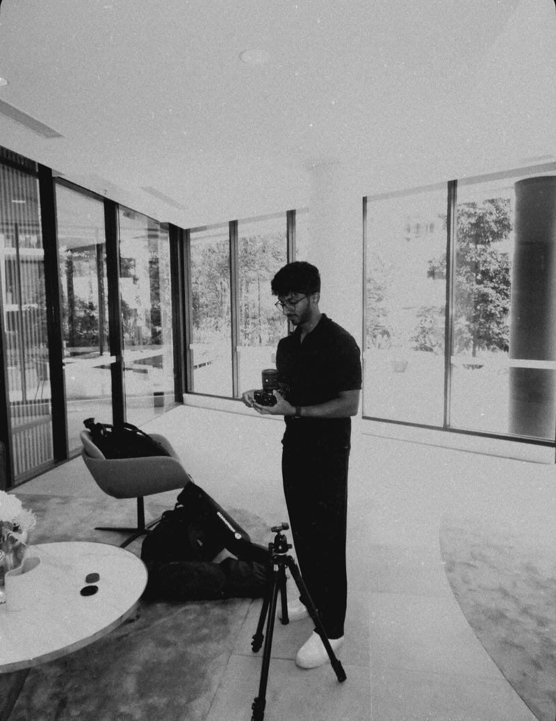 Vihan setting up camera and tripod before a workshop